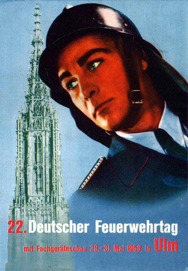 Plakat des 22. Feuerwehrtag in Ulm. Im Vordergrund ist ein Feuerwehrmann mit Helm zu sehen - im Hintergrund das Ulmer Münster